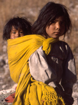 In Mexico's Copper Canyon, a Tarahumara girl carries her baby sister on her back.